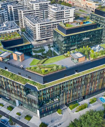Forest high-rise project in Warsaw with green roof and brown façade profiles.