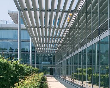 BriseSoleil solar shading outside a glass-and-aluminium office complex.